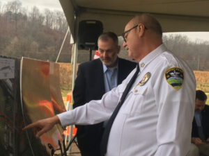 Newport Chief of Police Maurice Shults consults a map of the bypass.