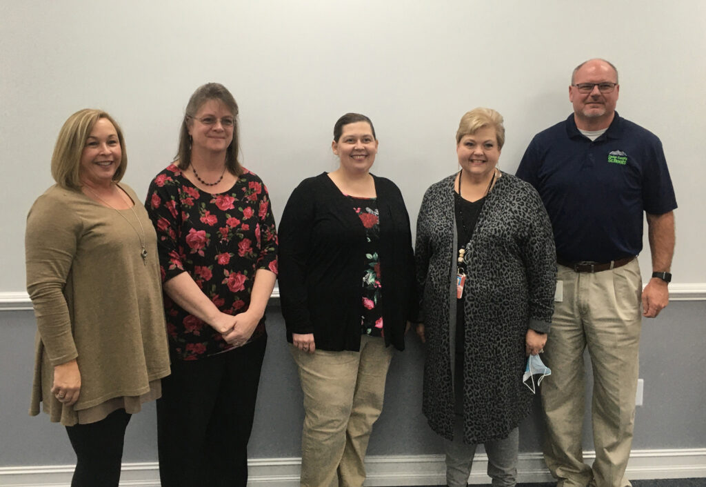 Three CCHS educators received tenure (center). From left to right: CCHS Principal Gail Burchette, Teachers Deborah Livesay, Amanda Marion and Darlene Shepherd, and Assistant Director of Schools Casey Kelley.